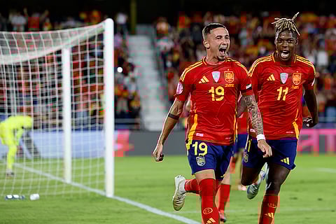Nations League Soccer: Spain's Yeremy Pino, left, celebrates with Niko Williams the opening goal