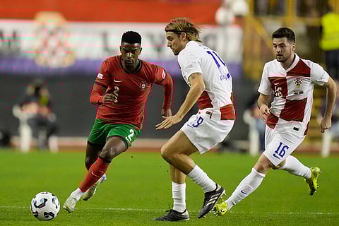Nations League Soccer: Portugal's Nelson Semedo, left, challenges for the ball with Croatia's Borna Sosa