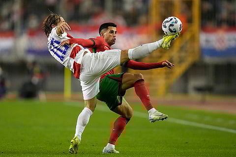 Nations League Soccer: Croatia's Luka Modric challenges for the ball with Portugal's Joao Cancelo