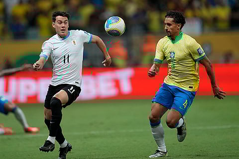 Football World Cup 2026 Qualifiers: Uruguay's Facundo Pellistri, left, and Brazil's Marquinhos battle for the ball