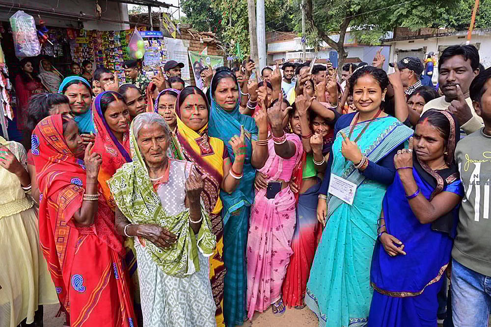| Photo: PTI : Kalpana Soren with women voters in Jharkhand