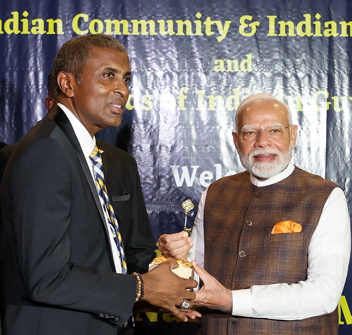 PTI :  Prime Minister Narendra Modi being felicitated with the 'Key to the City of Georgetown' by the Mayor Alfred Mentore upon the former's arrival at the hotel, in Georgetown, Guyana, Wednesday, Nov. 20, 2024. 