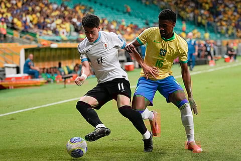 Football World Cup 2026 Qualifiers: Uruguay's Facundo Pellistri, left, is challenged by Brazil's Abner