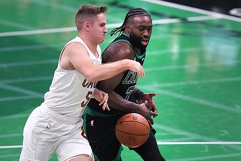 NBA Basketball: Cavaliers guard Sam Merrill, left, pressures Celtics guard Jaylen Brown (7)