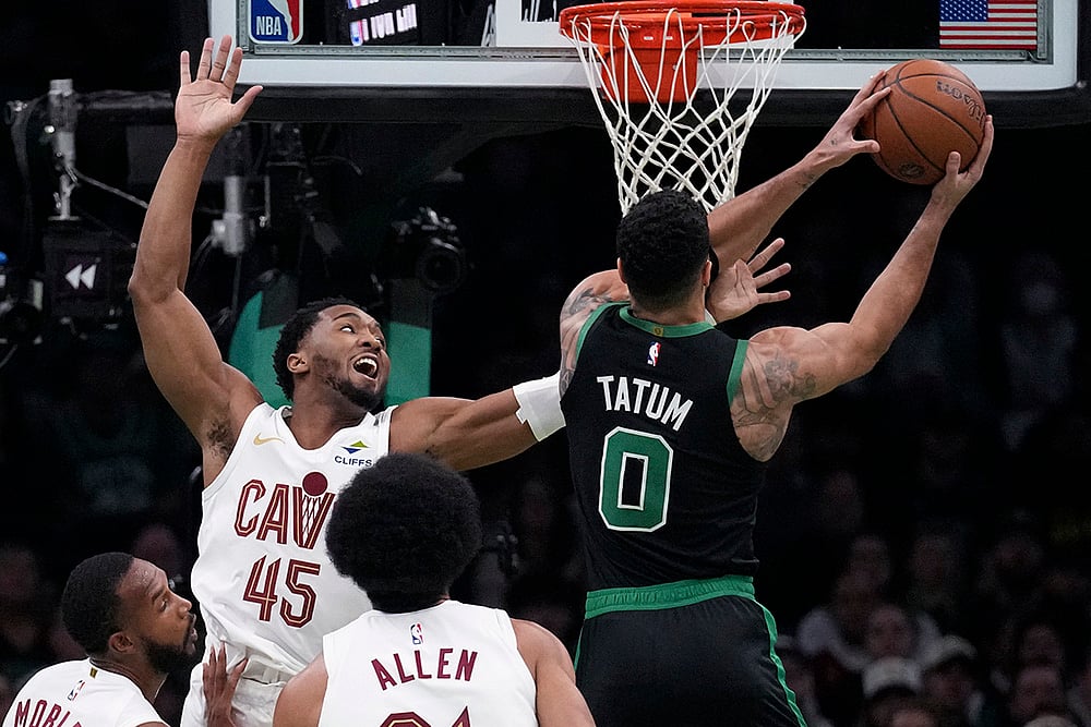 | Photo: AP/Charles Krupa : NBA Basketball: Celtics forward Jayson Tatum (0) drives to the basket against Cavaliers guard Donovan Mitchell (45)