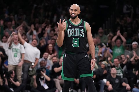 NBA Basketball: Boston Celtics guard Derrick White (9) celebrates after hitting a 3-pointer
