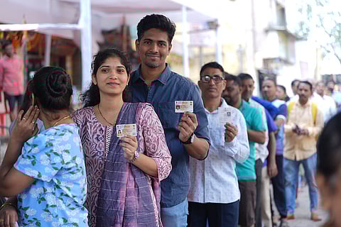 Maha Assembly polls: Voters wait in a queue to cast their votes