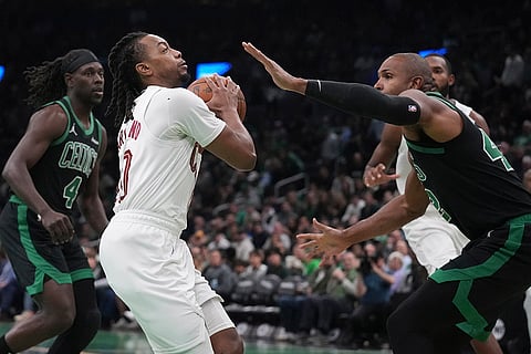 NBA Basketball: Cavaliers guard Darius Garland (10) drives to the basket against Celtics center Al Horford