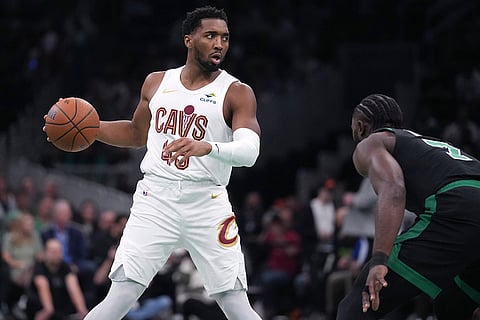 NBA Basketball: Cavaliers guard Donovan Mitchell (45) sets to drive against Celtics guard Jaylen Brown (7)