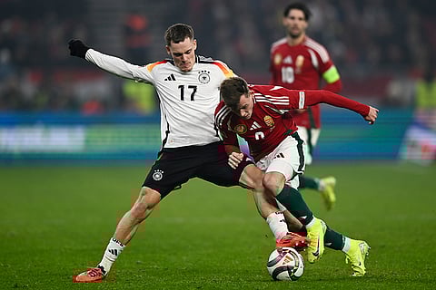 Nations League Soccer: Germany's FLorian Wirtz challenges for the ball with Hungary's Szabolcs Schon