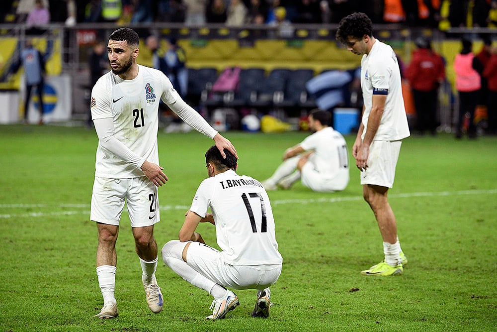 | Photo: Jakob Akersten Broden/TT News Agency via AP : Nations League Soccer: Azerbaijan's Abbas Huseynov, left, and Tural Bayramov, second left, after the match