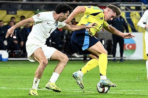 Nations League Soccer: Azerbaijan's Bahlul Mustafazada, left, and Sweden's Viktor Gyoekeres, right, challenge for the ball