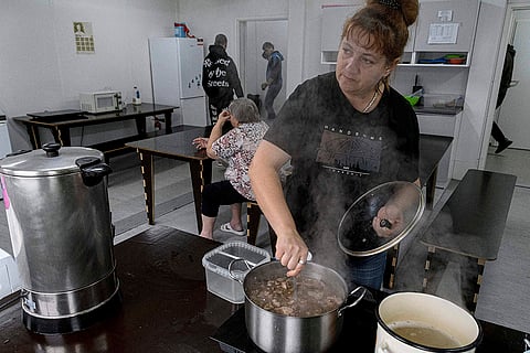 Russia Ukraine War 1000 Days: A woman cooks soup for displaced persons