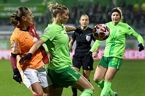 Women's Champions League: Galatasaray's Sagre Ozturk, left, and Wolfsburg's Alexandra Popp, front right, challenge for the ball