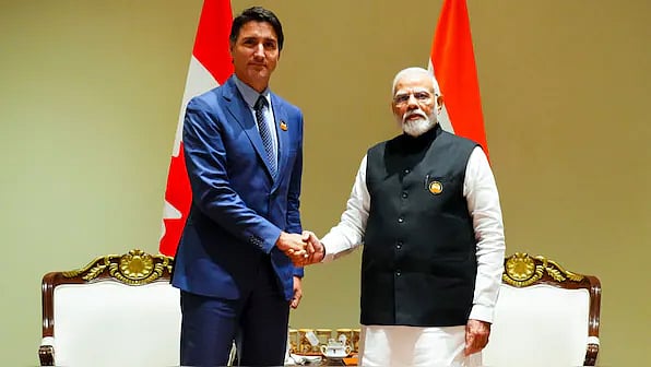 AP : Canadian PM Justin Trudeau (L) with PM Narendra Modi (R)