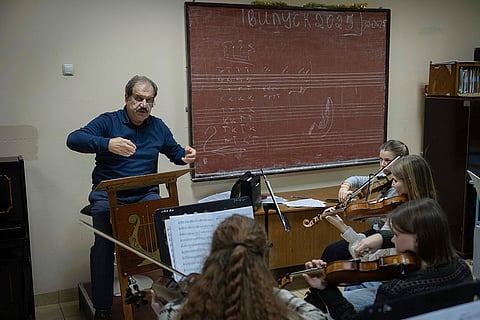 Russia Ukraine War 1000 Days: Volodymyr Sukhovetsky conducts a children's orchestra in a lesson in the basement shelter