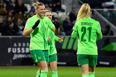 Women's Champions League: Wolfsburg's scorer Alexandra Popp, left, and her teammates celebrate the opening goal