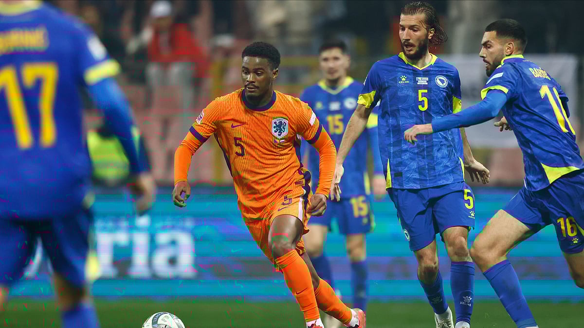 AP Photo/Armin Durgut : Jorrel Hato of the Netherlands, centre, is in action during the UEFA Nations League Group A3 football match between Bosnia-Herzegovina and the Netherlands at Bilino Polje stadium in Zenica, Bosnia.