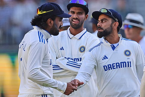 IND Vs AUS 1st Test, Day 1: India's KL Rahul, left, and teammate Virat Kohli celebrate the wicket of Australia's Mitchell Marsh