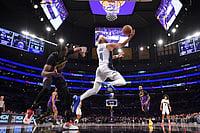 NBA: Franz Wagner's Last-Second 3-Pointer Ends Lakers' Winning Streak, Magic Snatch 119-118 Victory - In Pics | Photo: AP/Mark J. Terrill : NBA: Magic guard Jalen Suggs, right, shoots as Lakers center Christian Koloko defends