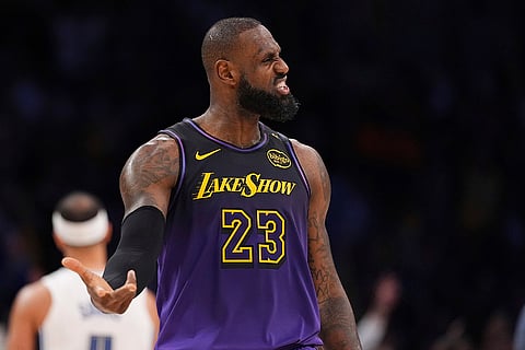 NBA: Lakers forward LeBron James reacts after scoring