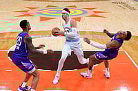 NBA: San Antonio Spurs Rally In Fourth Quarter To Beat Jazz - In Pics | Photo: AP/Eric Gay : NBA: Spurs forward Zach Collins (23) drives to the basket against Jazz forward John Collins (20) and guard Keyonte George