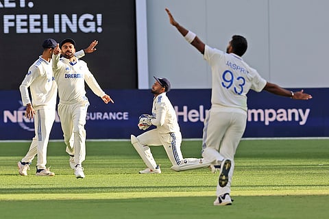 IND Vs AUS 1st Test, Day 1: India's captain Jasprit Bumrah, right, and teammates celebrate the wicket of Australia's captain Pat Cummins
