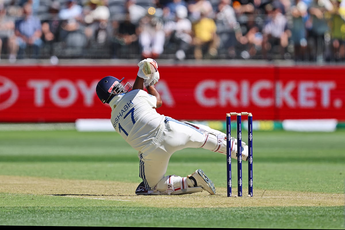  (AP Photo/Trevor Collens) : India's Rishabh Pant loses his balance after hitting a six during play in the first cricket test between India and Australia in Perth, Australia, Friday, Nov. 22, 2024.
