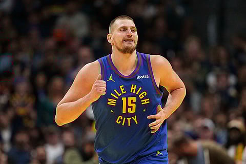 NBA 2024-25: Nuggets center Nikola Jokic smiles after making a basket