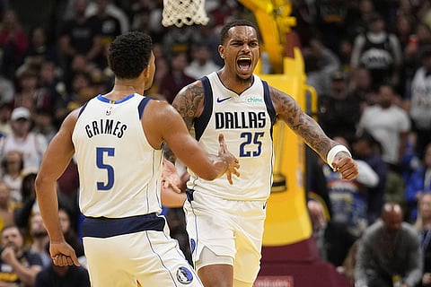 NBA 2024-25: Mavericks forward P.J. Washington (25) celebrates a basket against the Nuggets