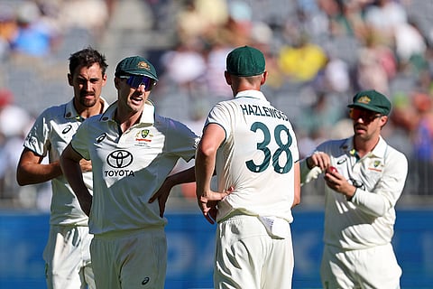 IND Vs AUS 1st Test, Day 2: Australia's captain Pat Cummins, second left, has a chat with teammate Josh Hazlewood