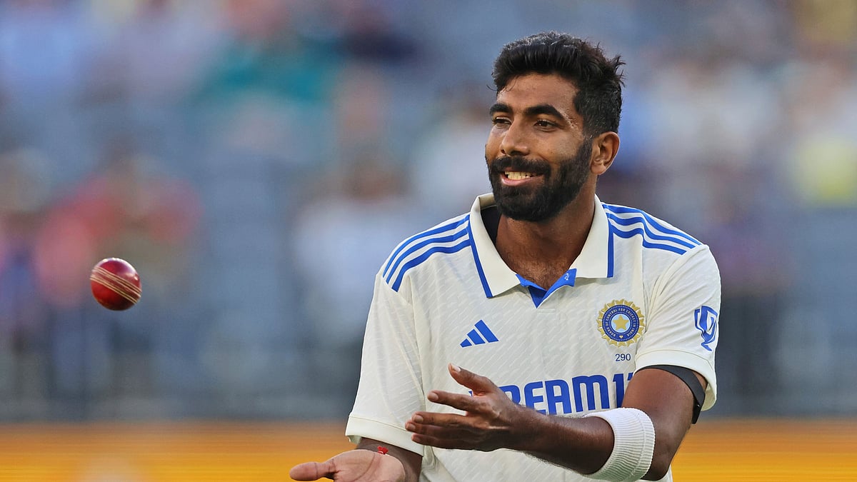 India's captain Jasprit Bumrah collects the ball as he prepares to bowl on the first day of the first cricket test between Australia and India in Perth. - AP Photo/Trevor Collens