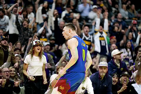 NBA 2024-25: Nuggets guard Christian Braun celebrates a three point basket against the Mavericks