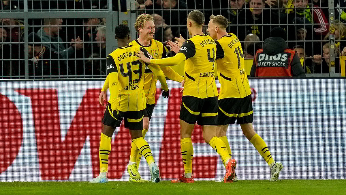 Borussia Dortmund celebrate their third goal against Freiburg - null
