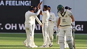 AP/Trevor Collens : India celebrate the wicket of Australia captain Pat Cummins on the first day of the first Test in Perth.