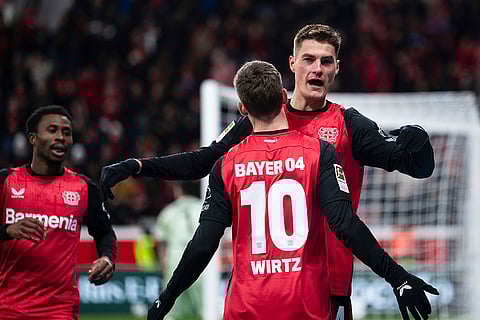 Bundesliga 2024-25: Leverkusen's scorer Patrik Schick, right, and his teammate Florian Wirtz celebrate their side's third goal