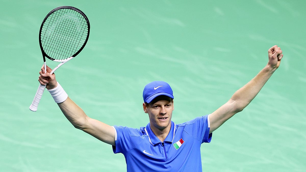 Jannik Sinner celebrates after converting match point