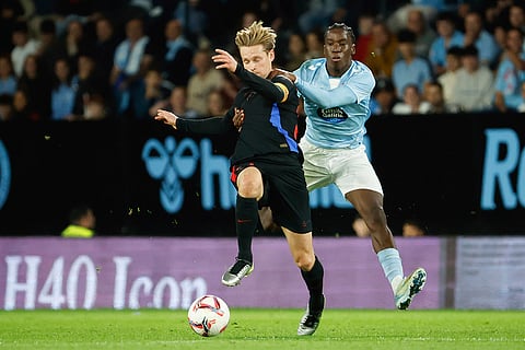 La Liga: Celta's Ilaix Moriba, right, fouls Barcelona's Frenkie de Jong