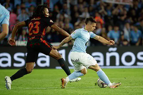 La Liga: Celta's Alfon, right, is challenged by Barcelona's Jules Kounde
