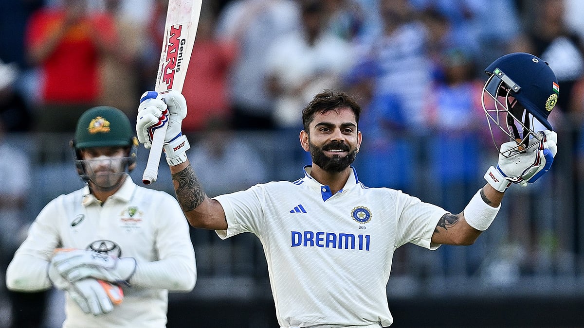 Virat Kohli celebrates after century - null