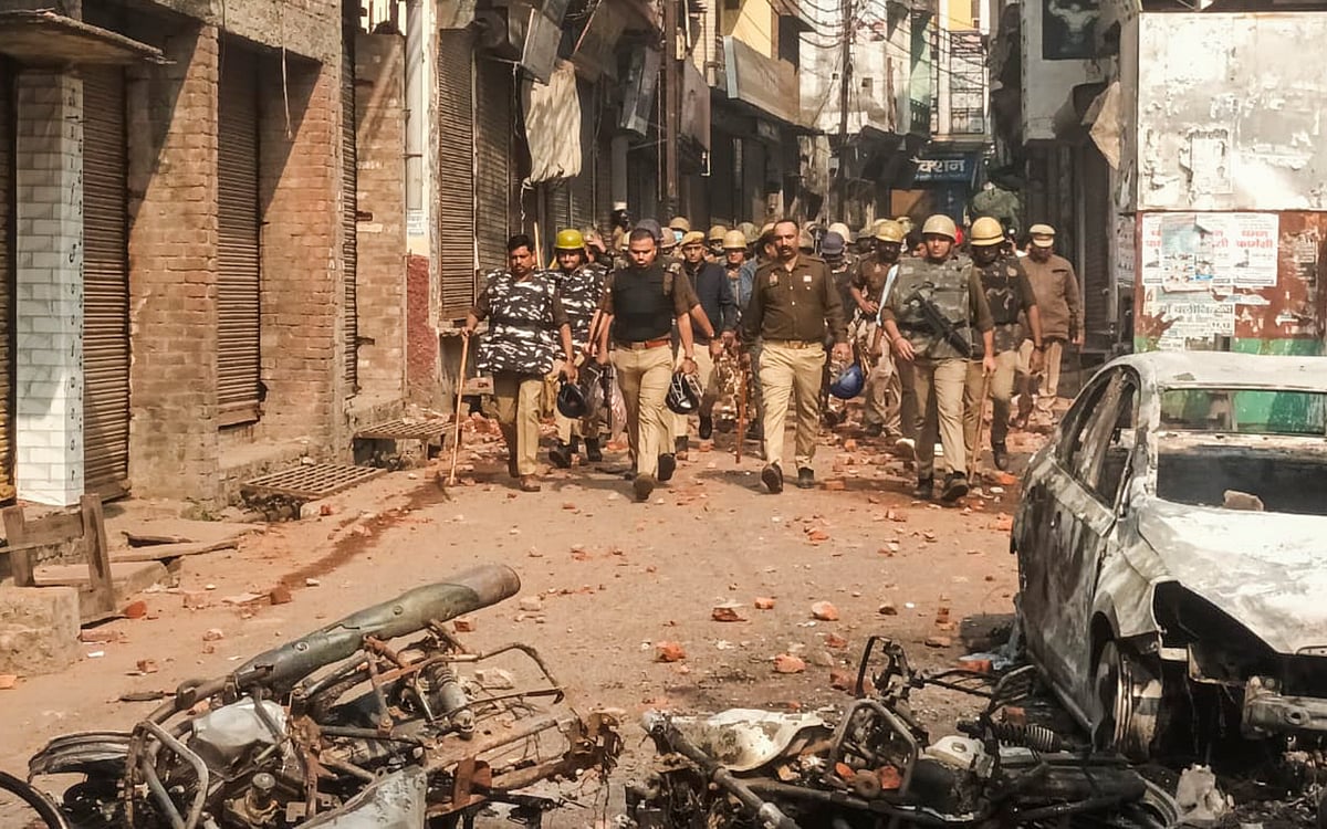 PTI : Police and security personnel stand guard amid violence during a second survey of the Jama Masjid |
