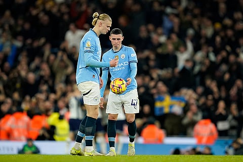 EPL 2024-25: Manchester City's Phil Foden, right, and Erling Haaland stand near the center circle after Tottenham scored