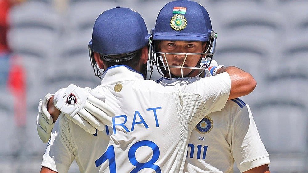 | Photo: AP/Trevor Collens : IND Vs AUS 1st Test, Day 3: India's Yashasvi Jaiswal is congratulated by Virat Kohli for completing his 150 runs