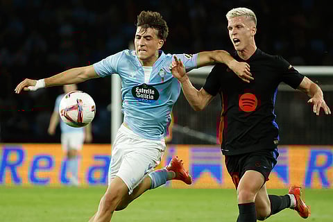 La Liga: Celta's Javi Rodriguez, left, and Barcelona's Dani Olmo fight for the ball