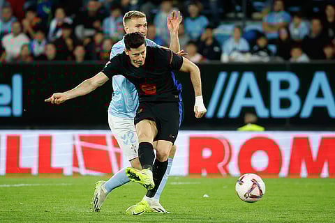 La Liga: Barcelona's Robert Lewandowski scores his side's 2nd goal challenged by Celta's Carl Starfelt