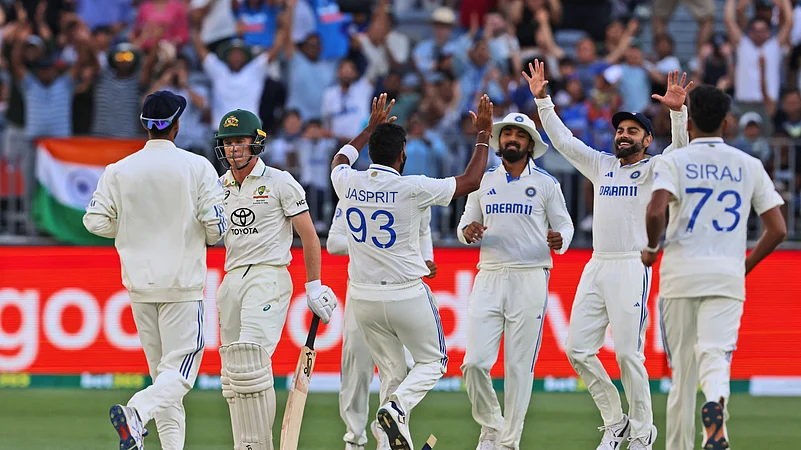 Indias captain Jasprit Bumrah, center, celebrates with teammates. AP Photo