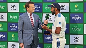 AP/Trevor Collens : Jasprit Bumrah talking to Adam Gilchrist after the first Test.