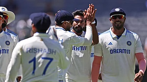 AP/Trevor Collens : Mohammed Siraj, centre, celebrates with teammates the wicket of Usman Khawaja during the first India vs Australia Test in Perth.