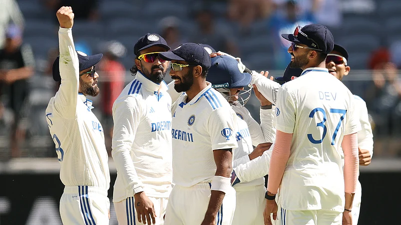 India celebrate a wicket against Australia