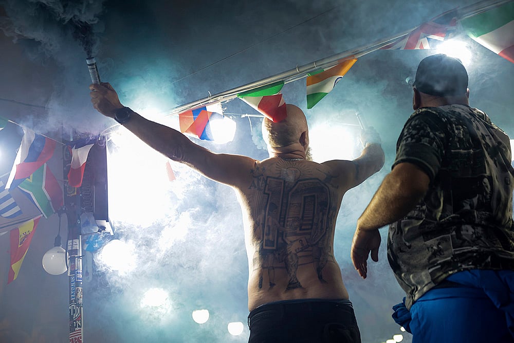 | Photo: Alessandro Garofalo/LaPresse via AP : Italy Maradona death anniversary: Fans light flares and sing to honor soccer legend Diego Armando Maradona